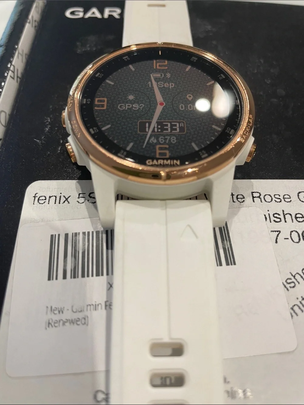 Garmin Fenix 5s Plus smartwatch in white with rose gold bezel